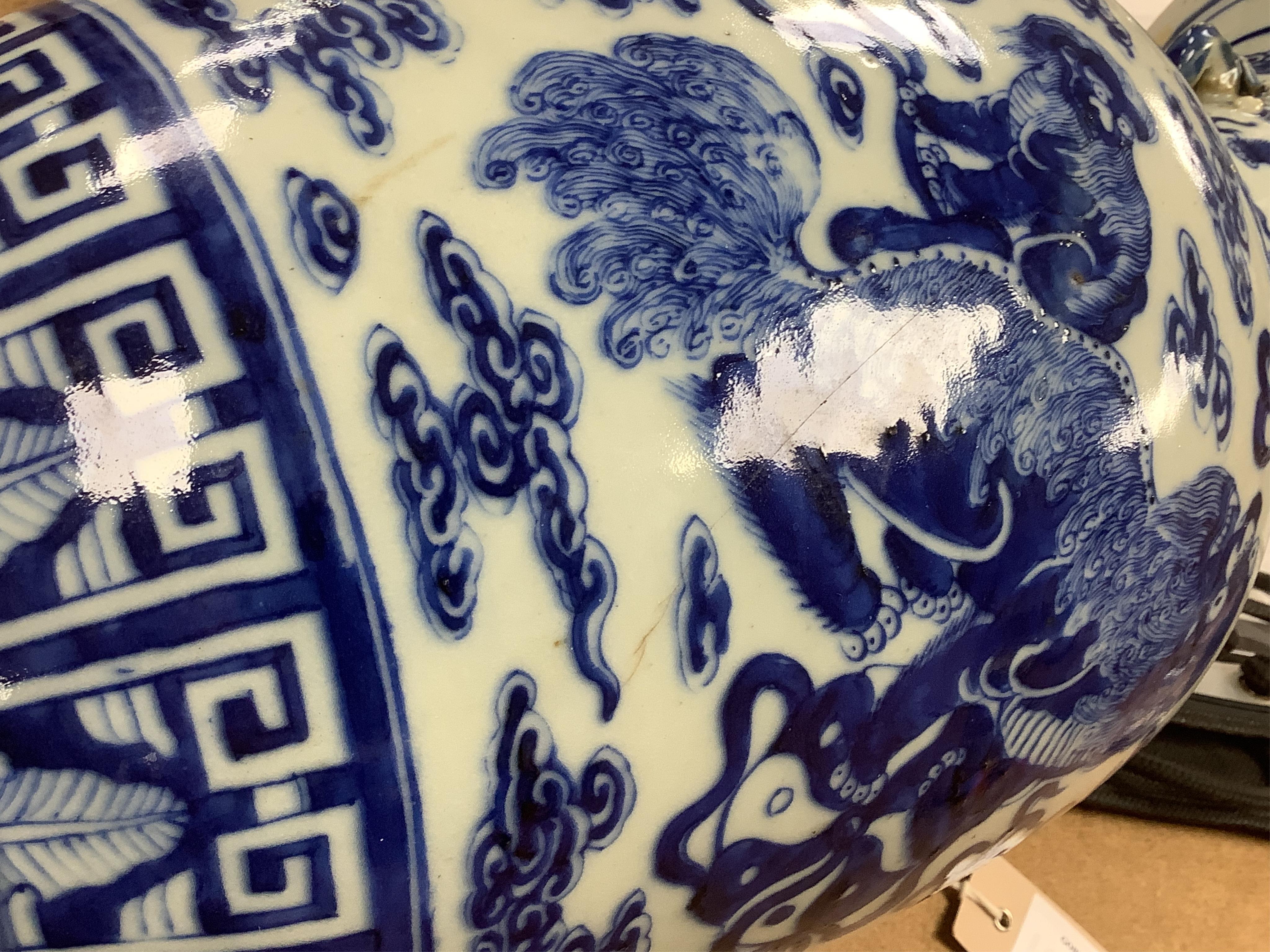 A Chinese baluster vase, painted with Buddhist lions in underglaze blue, 45cm high